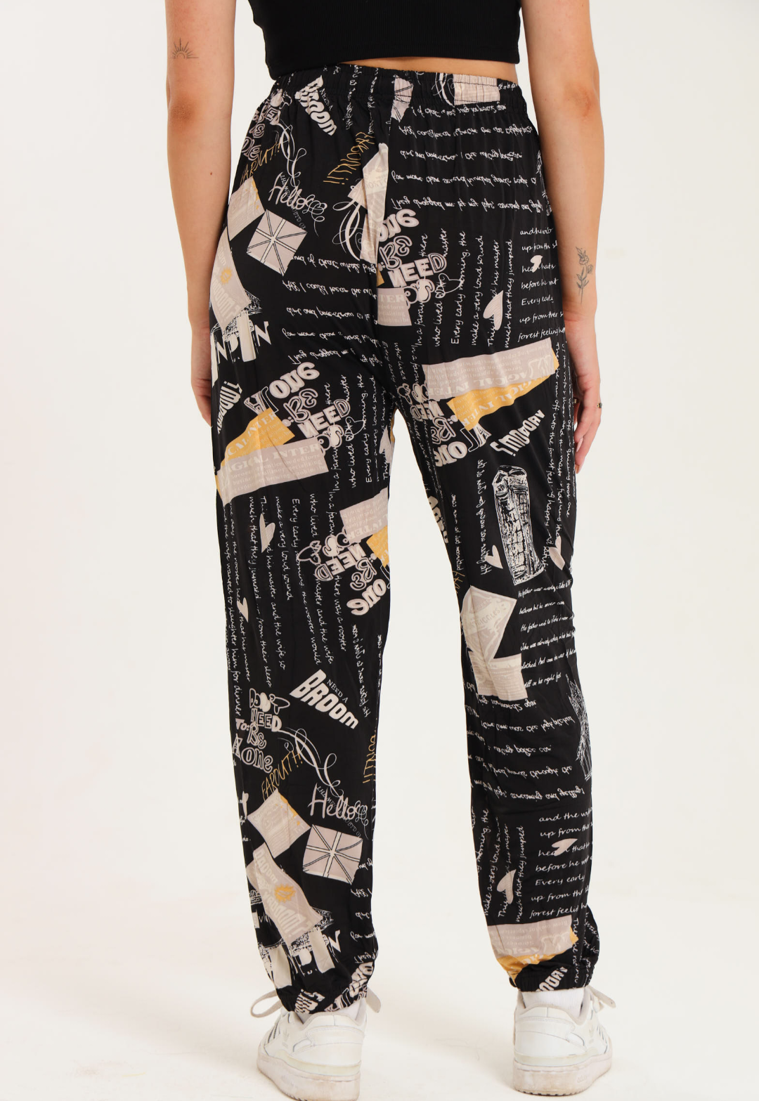 Casual harem wide leg pants with printed design, elastic waistband, gathered ankle cuffs, and adjustable drawstring.