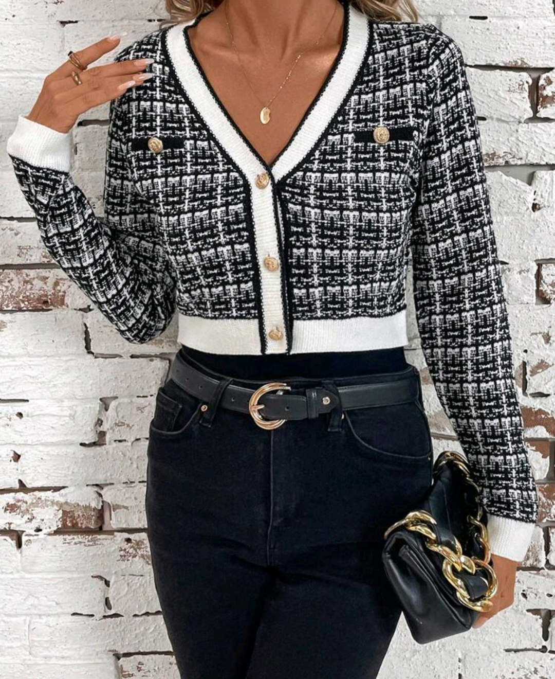 Women's plaid cardigan with contrast trim, long sleeves, and decorative buttons.