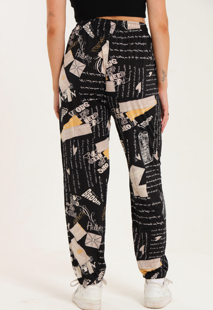 Casual harem wide leg pants with printed design, elastic waistband, gathered ankle cuffs, and adjustable drawstring.