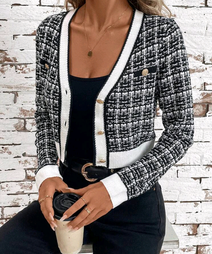 Women's plaid cardigan with contrast trim and long sleeves.