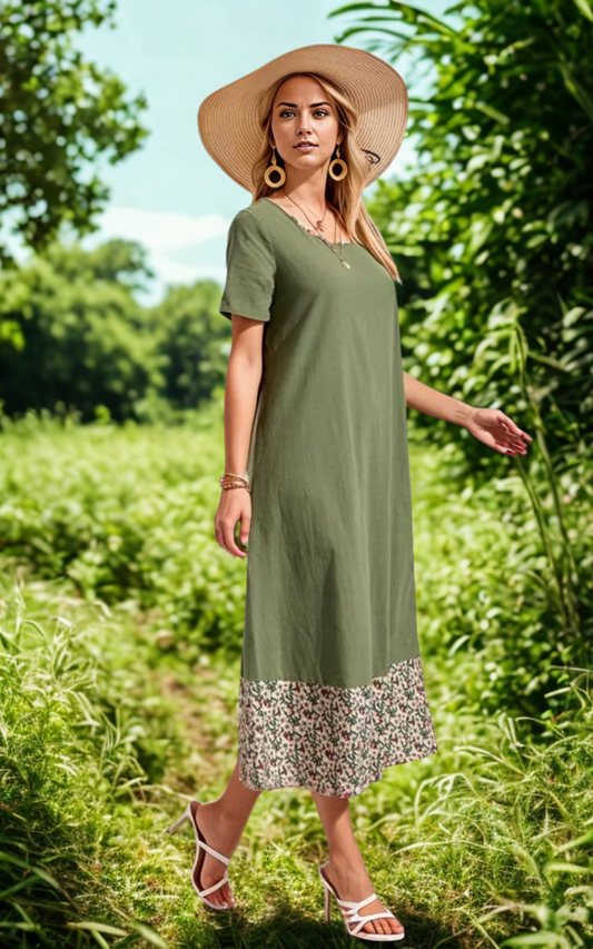 Woman wearing casual floral binding dress with round neck and short sleeves outdoors