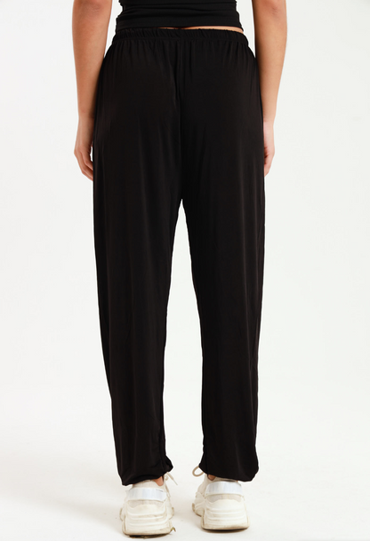 Casual black harem wide leg pants with elastic waistband for versatile and comfortable everyday wear.